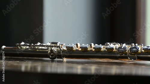 Detail of flute on a wooden table