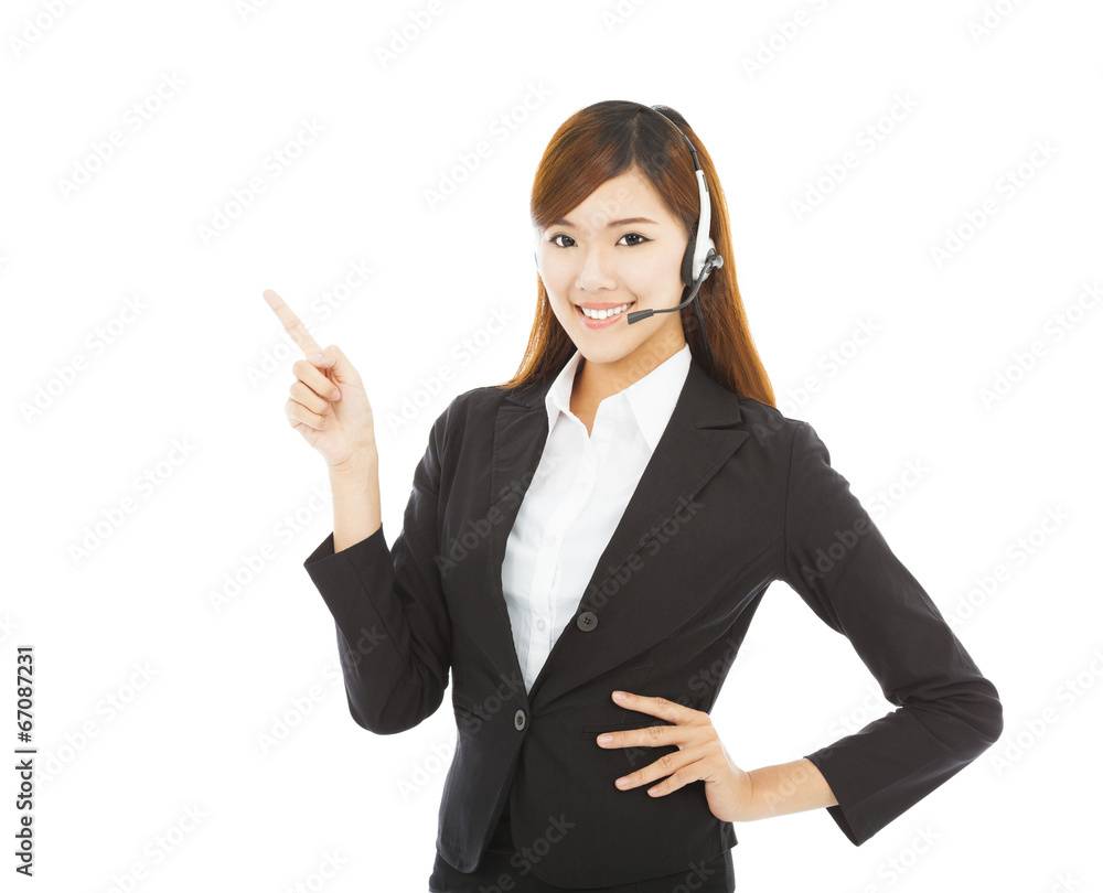 smiling business woman with headphone and point up smiling business woman with headphone and point up