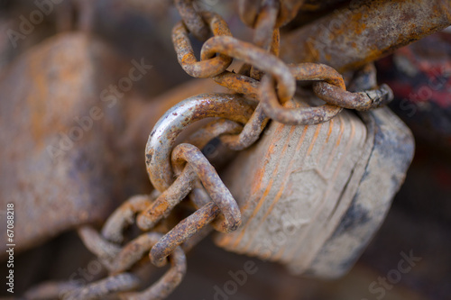 Close up of rusty chain with padlock