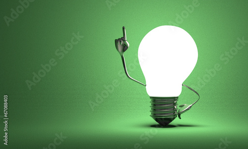 Fotografie Light bulb with big hands in moment of insight on green