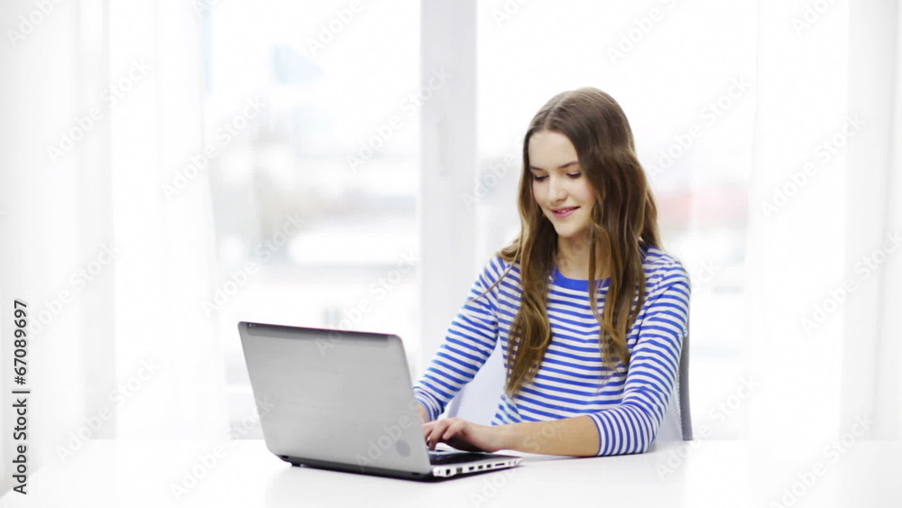 smiling teenage girl with laptop computer at home smiling teenage girl with laptop computer at home