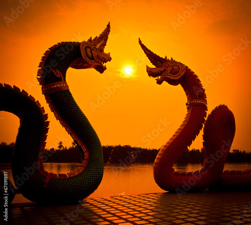 Silhouettes of Naga statue at the temple in Thailand