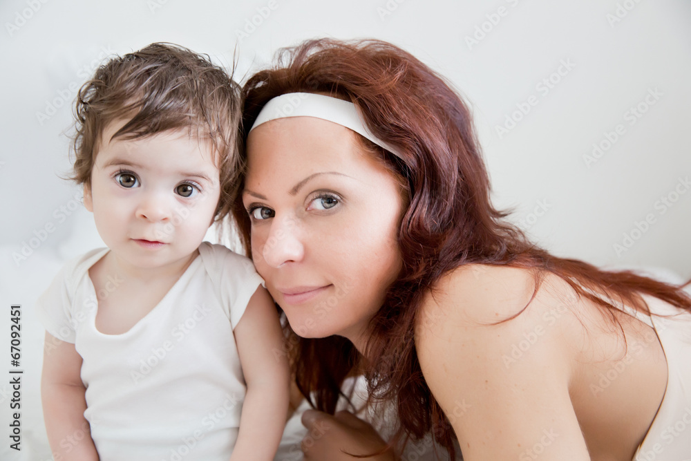 happy-looking baby  and mother playing together