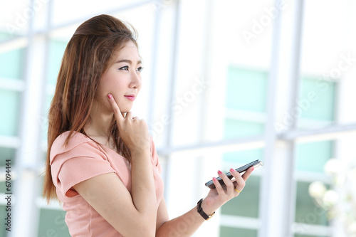 Free Download Portrait lovely girl type information with her mobile phone - GFXLoad