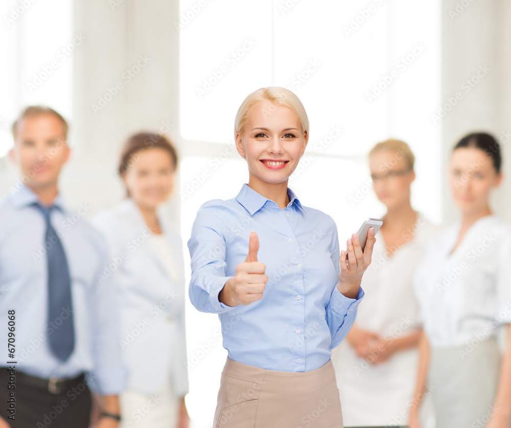 young smiling businesswoman with smartphone young smiling businesswoman with smartphone