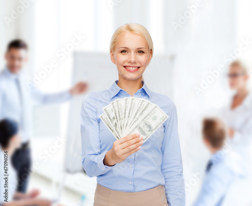 young businesswoman with dollar cash money