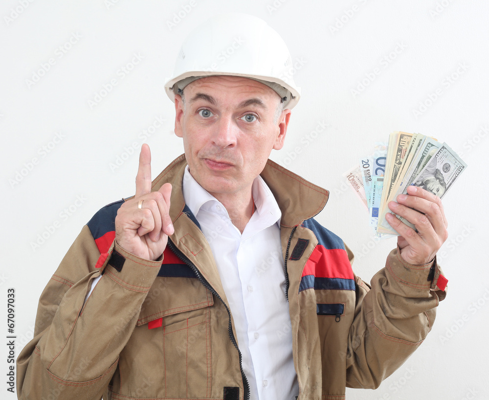 man in uniform with white construction helmet and holding money man in uniform with white construction helmet and holding money