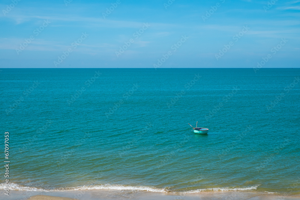 Boat floating in blue sea