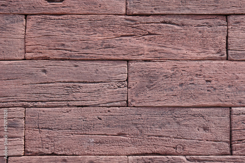 Slabs imitation red wood on wall closeup