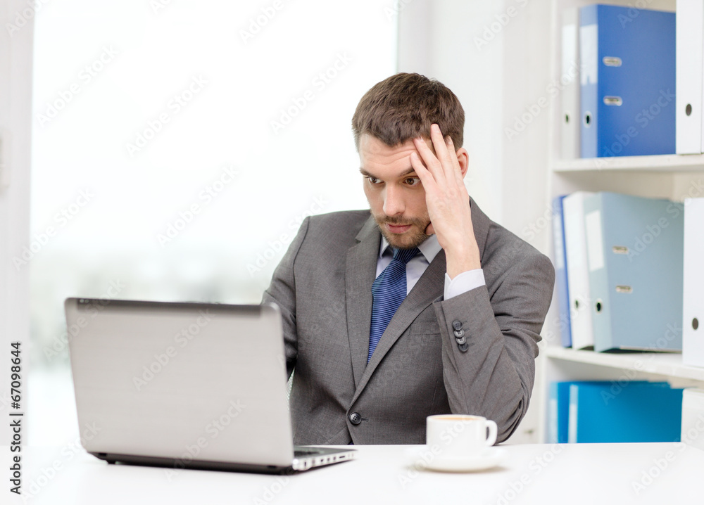 busy businessman with laptop and coffee busy businessman with laptop and coffee