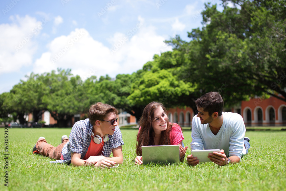 Happy College students using computer Happy College students using computer