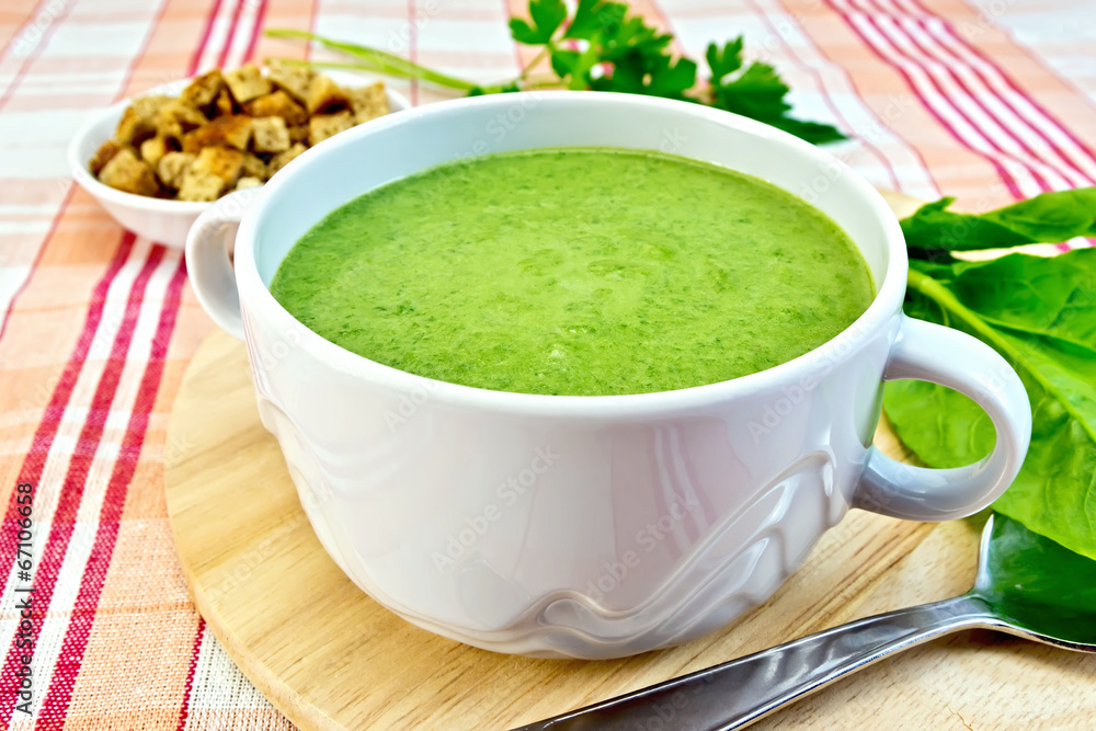 Soup puree with spinach on fabric Soup puree with spinach on fabric
