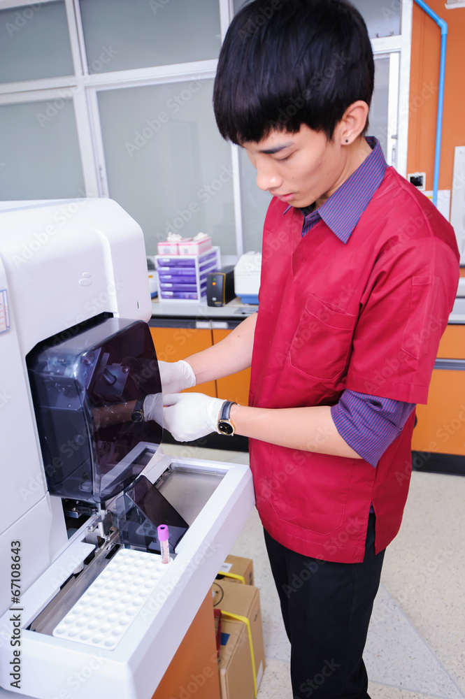 Scientist assistant working at the blood laboratory