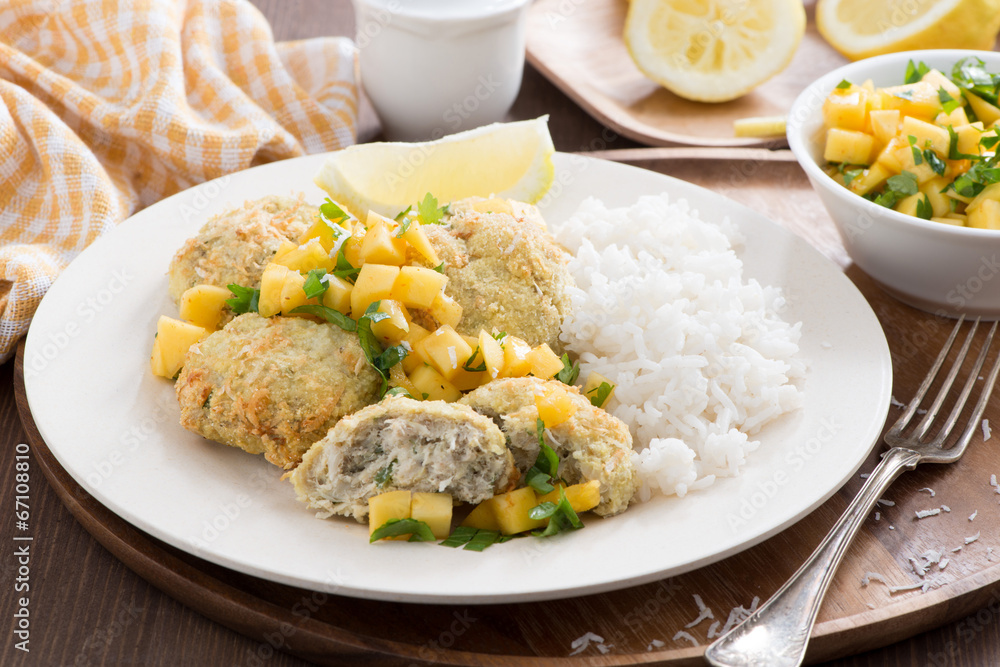 fish cakes with mango salsa and rice