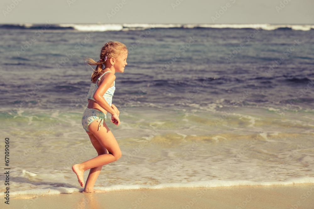 little girl running on the beach little girl running on the beach