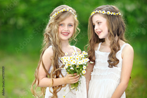Fotografie Portrait of two girls in the woods girlfriends