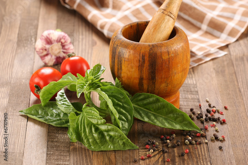 fresh basil, tomato, garlic, wooden mortar