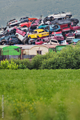 Pile of used cars in junkyard