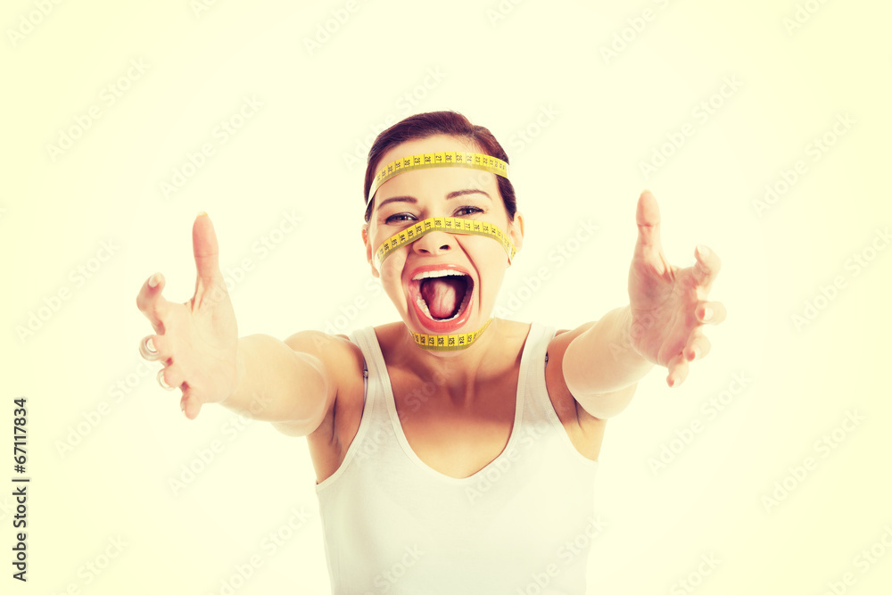 Woman's face with measuring tape Woman's face with measuring tape