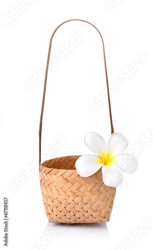 Bamboo basket with frangipani, plumeria isolate on white