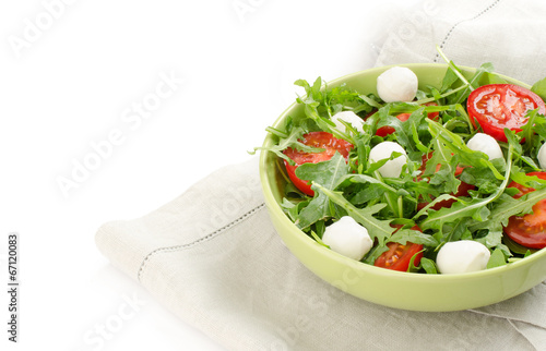 salad from arugula tomatoes and mozzarella