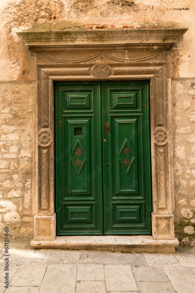 Beautiful old green wooden in historic Sibenik, Croatia