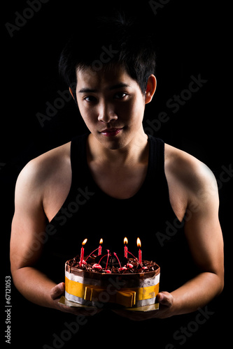 Asian boy with birthday cake
