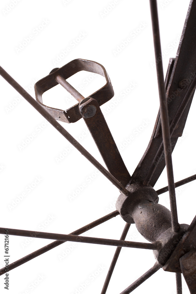 Close up on a iron pedal of a historical children' bicycle Close up on a iron pedal of a historical children' bicycle