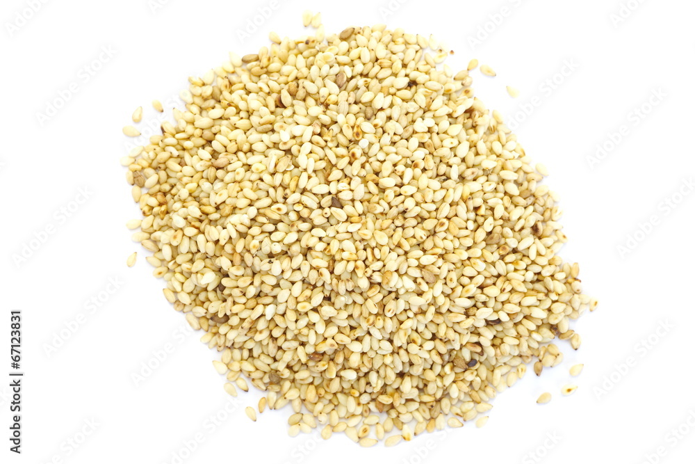 Natural sesame seeds on a white Natural sesame seeds on a white