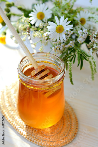 Jar full of honey and chamomile