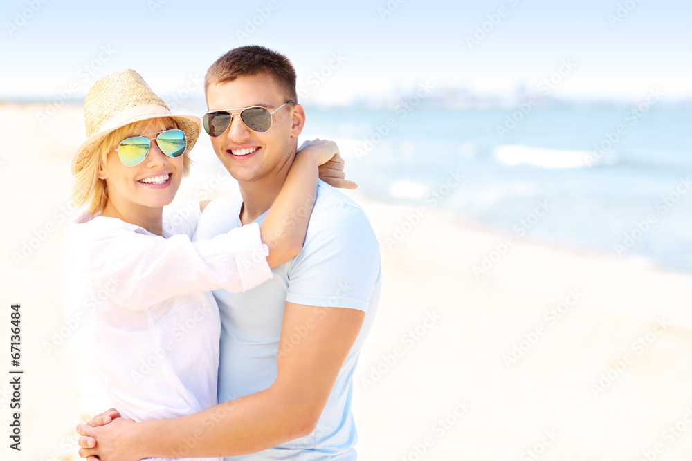 Adult happy couple hugging at the beach Adult happy couple hugging at the beach