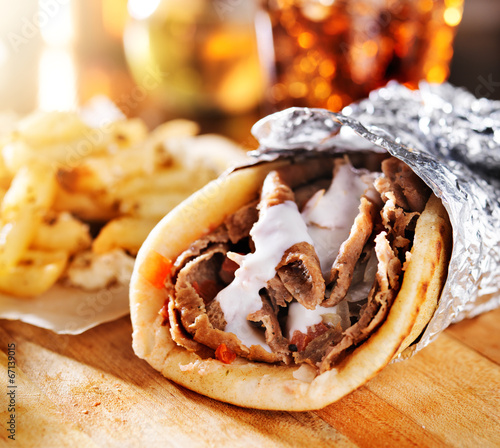 greek gyro with fries close up