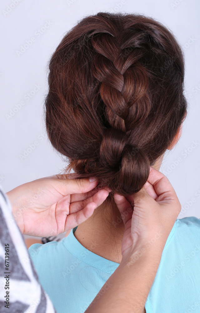 Fototapeta premium Creating hairstyles hairdresser close-up