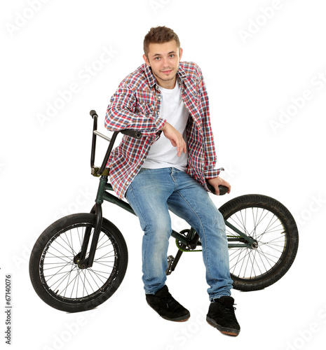 Young boy on BMX bike isolated on white
