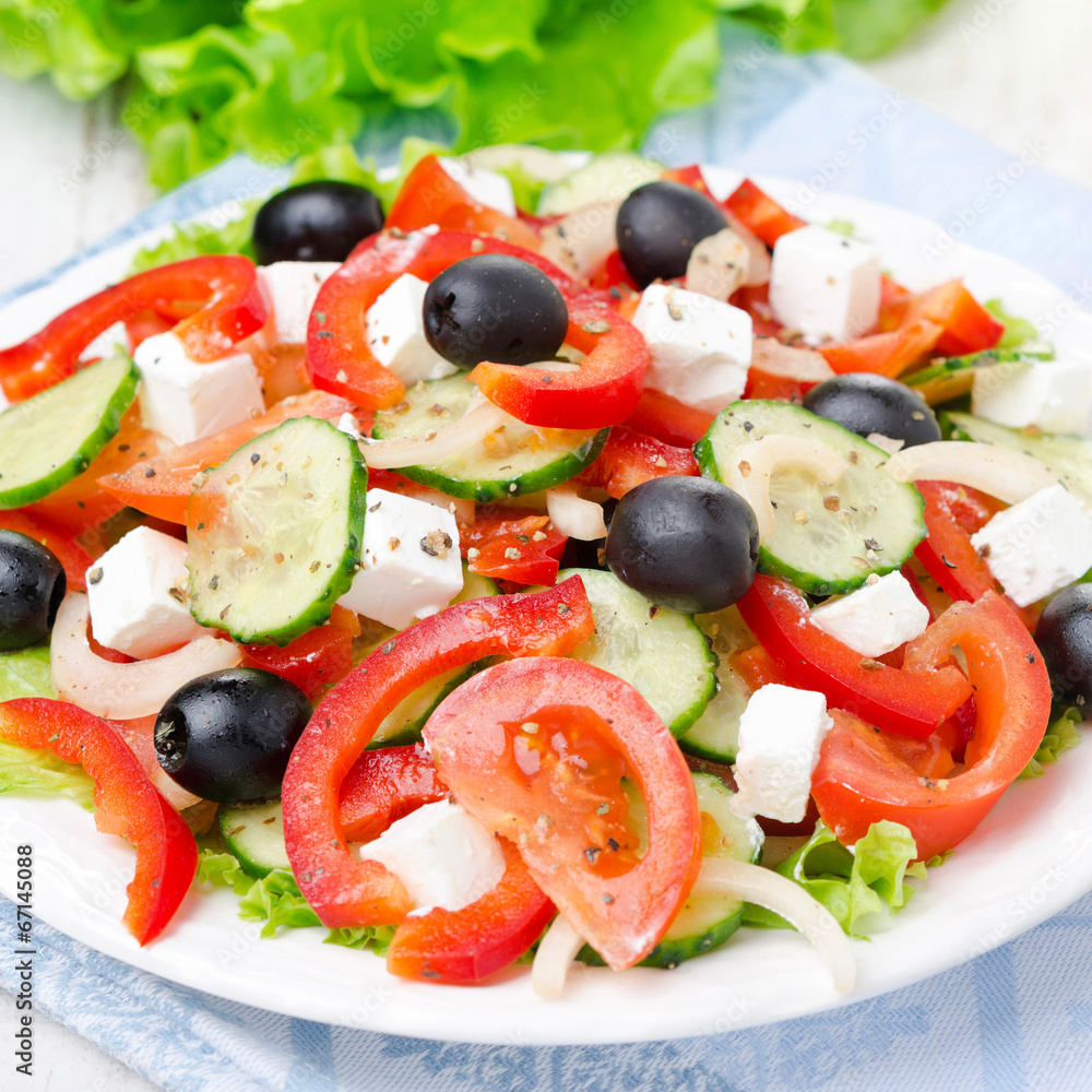 Greek salad with feta cheese, olives and vegetables, close-up Greek salad with feta cheese, olives and vegetables, close-up