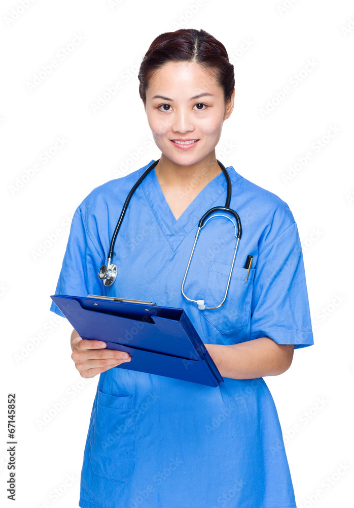 Asian female doctor write on clipboard Asian female doctor write on clipboard