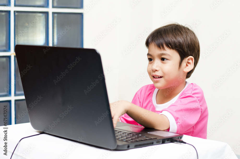 Little boys use laptop for education