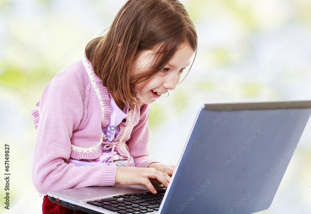 girl pressing the keys of the laptop. girl pressing the keys of the laptop.