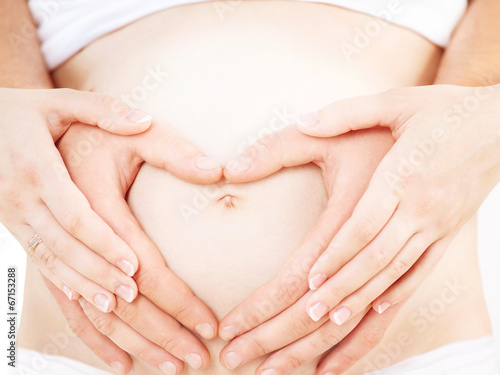 Wallpaper Mural Pregnant Woman and her Husband Together Caressing Pregnant Belly Torontodigital.ca