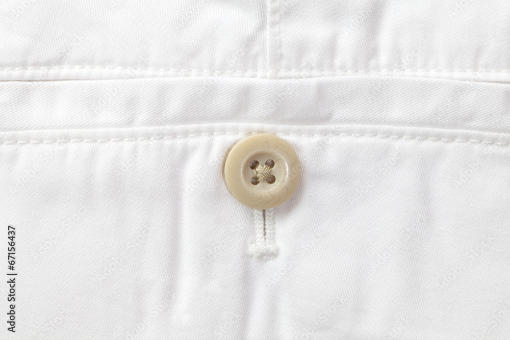Close - up button and white short pants Close - up button and white short pants