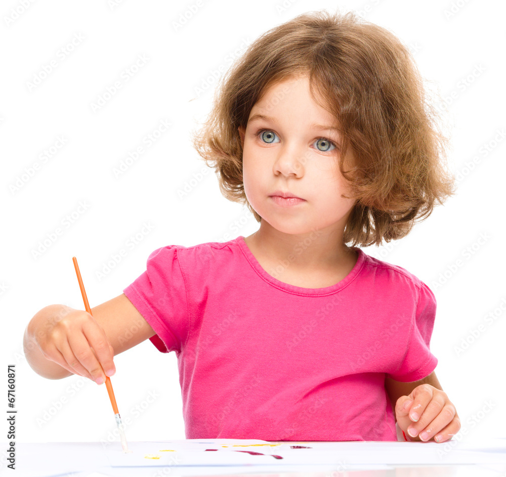 Little girl is painting with gouache Little girl is painting with gouache