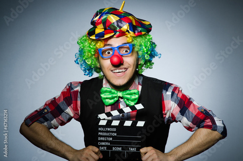 Clown with the movie board