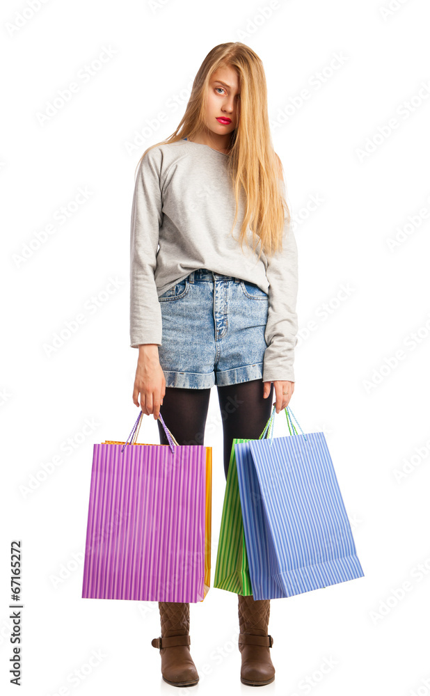 Young stressed woman surrounded by paperbags Young stressed woman surrounded by paperbags