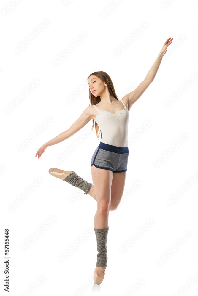 Beautiful ballet dancer posing in studio