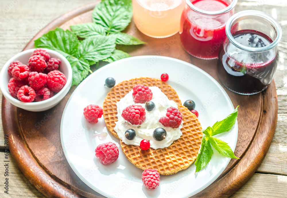 Belgian waffles with whipped cream and fresh berries Belgian waffles with whipped cream and fresh berries