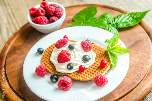 Belgian waffles with whipped cream and fresh berries