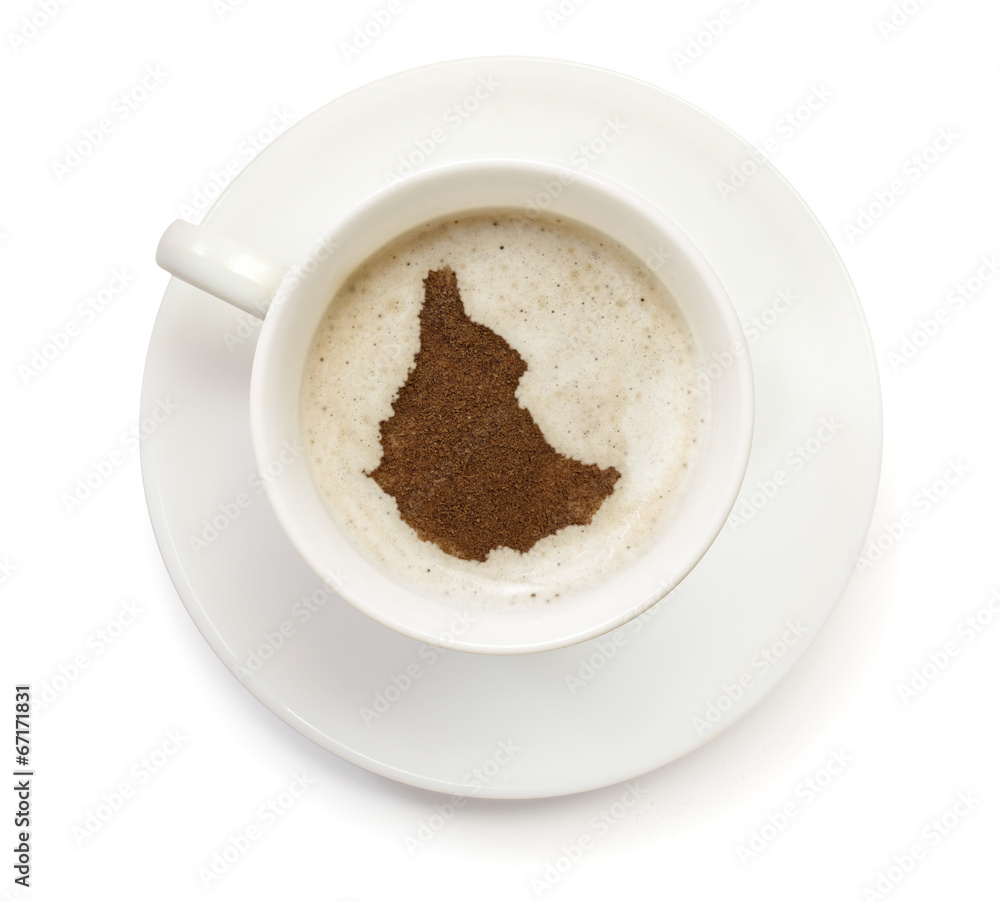 Obraz premium Cup of coffee with foam and powder in the shape of Ethiopia.(ser