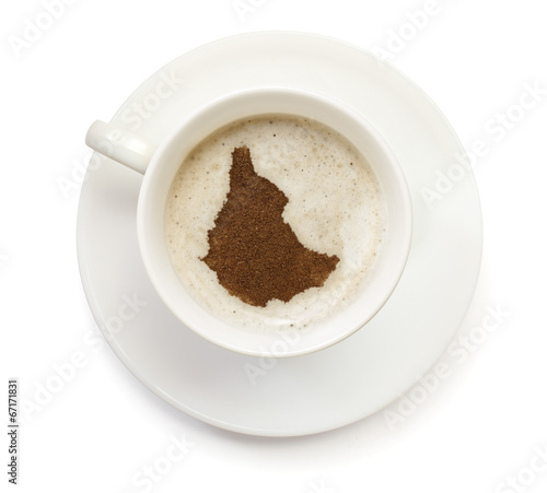 Cup of coffee with foam and powder in the shape of Ethiopia.(ser