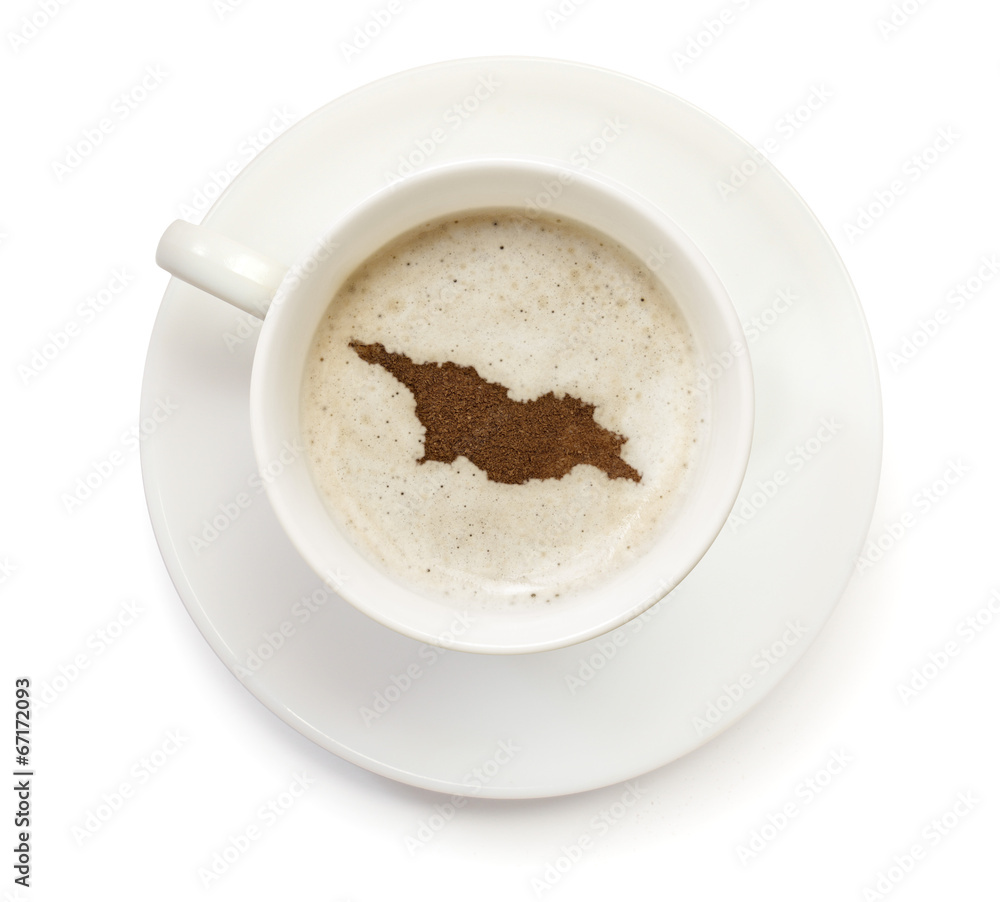 Cup of coffee with foam and powder in the shape of Georgia.(seri Cup of coffee with foam and powder in the shape of Georgia.(seri