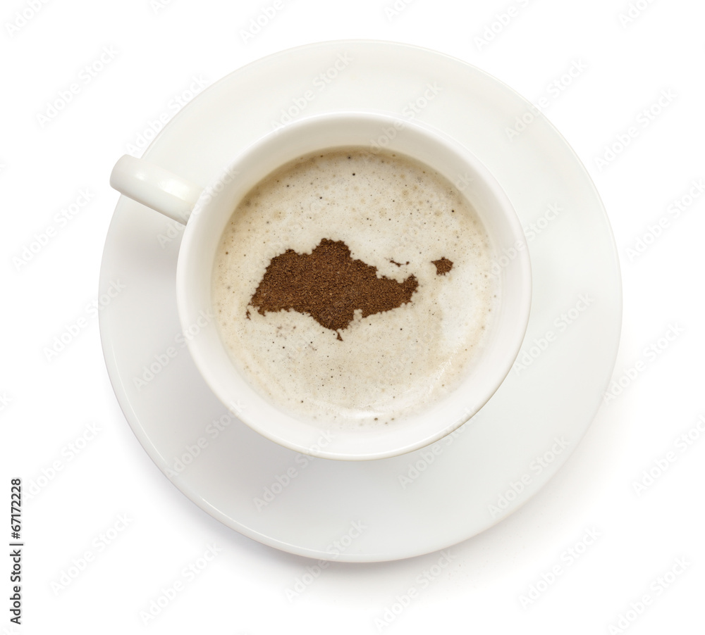 Cup of coffee with foam and powder in the shape of Singapore.(se Cup of coffee with foam and powder in the shape of Singapore.(se